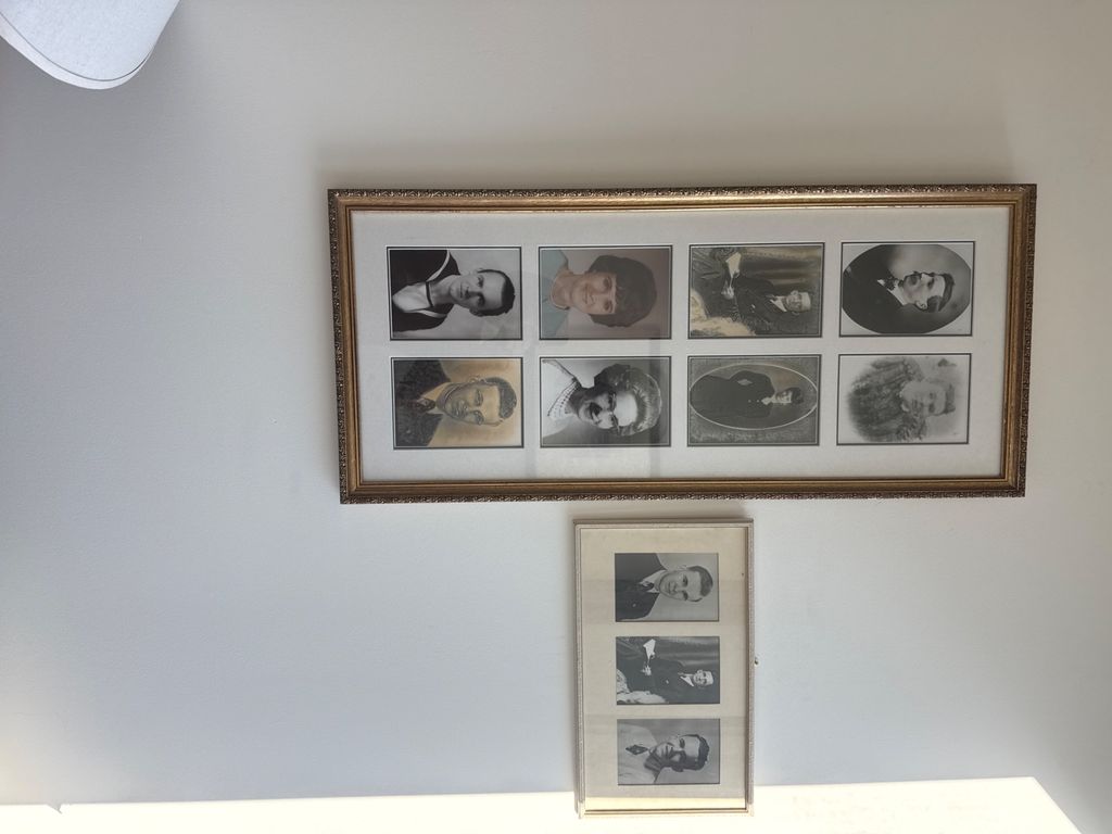 Two framed black-and-white portrait displays mounted together